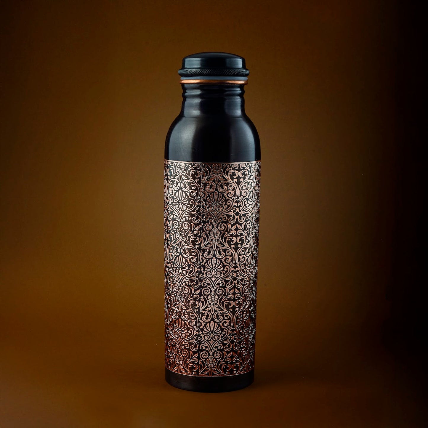 100% Pure Ayurvedic Copper Water Bottle with hammered floral design by LIVINGNISH. Elegant black and copper finish for natural wellness hydration.