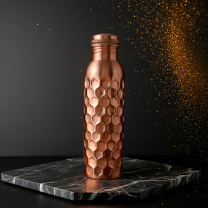 Honeycomb 100% Pure Ayurvedic Copper Water Bottle with textured hexagonal design, ideal for yoga and wellness, displayed on a marble base.